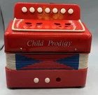 Child Prodigy Red Accordion Used. Price: $21.99.