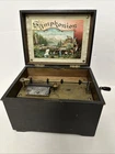 Antique German Schutz Marke Symphonion 7.5 Disc Music Box Floral Lid Lithograph For. Price: $255.00.