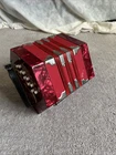 Mirage 20 Button 40 Reed Concertina Red Accordion With Travel Case Included Open. Price: $400.00.
