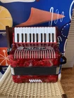 Hohner 1303-RED 26-KEYS Piano Accordion Open. Price: $500.00.