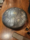 Steel Tongue Drum Aklot 11 Notes 10 Inch Tank Percussion Used. Price: $45.00.