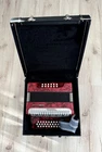 Hohner International Accordion, Red Pearl, Key Of Gcf. En Tono De Sol.w/suitcase Used. Price: $712.00.