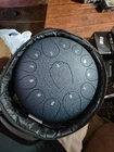 Nbmicso Steel Tongue Drum- 13 Note 12 Inches C-key Rain Sound Healing Open. Price: $84.99.
