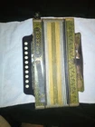 Vintage Hohner 10 Button Meladon Used. Price: $700.00.