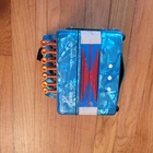 Hero Kids Green Marbled Accordion Musical Instrument Used. Price: $30.00.