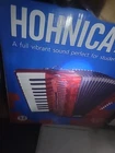 Hohner Accordions 1303-RED 12 Bass Entry Level Piano Open. Price: $599.99.