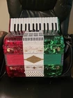 Rossetti 3032 Key Switch Piano Red/white/green With Straps, Case New. Price: $700.00.